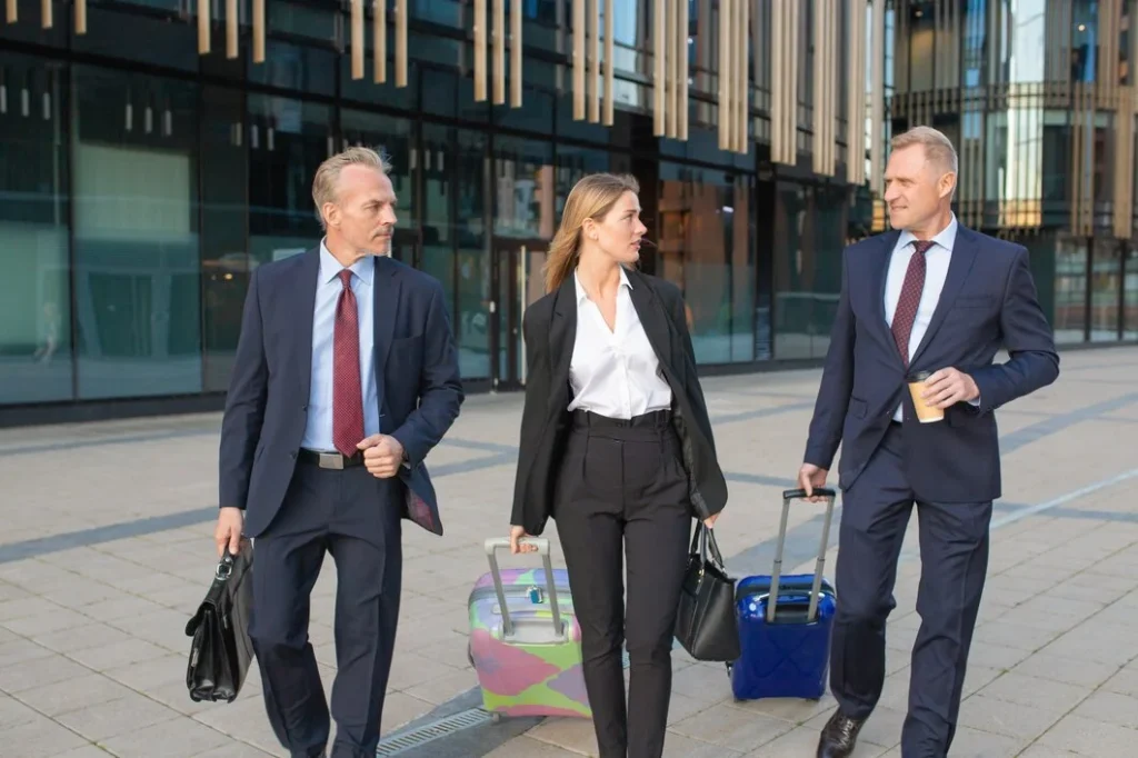 business people travelling with luggage
